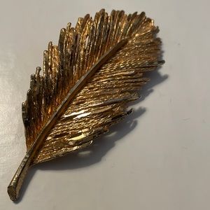 Some gold is missing zoom on pics. Pretty , sparkling pin.